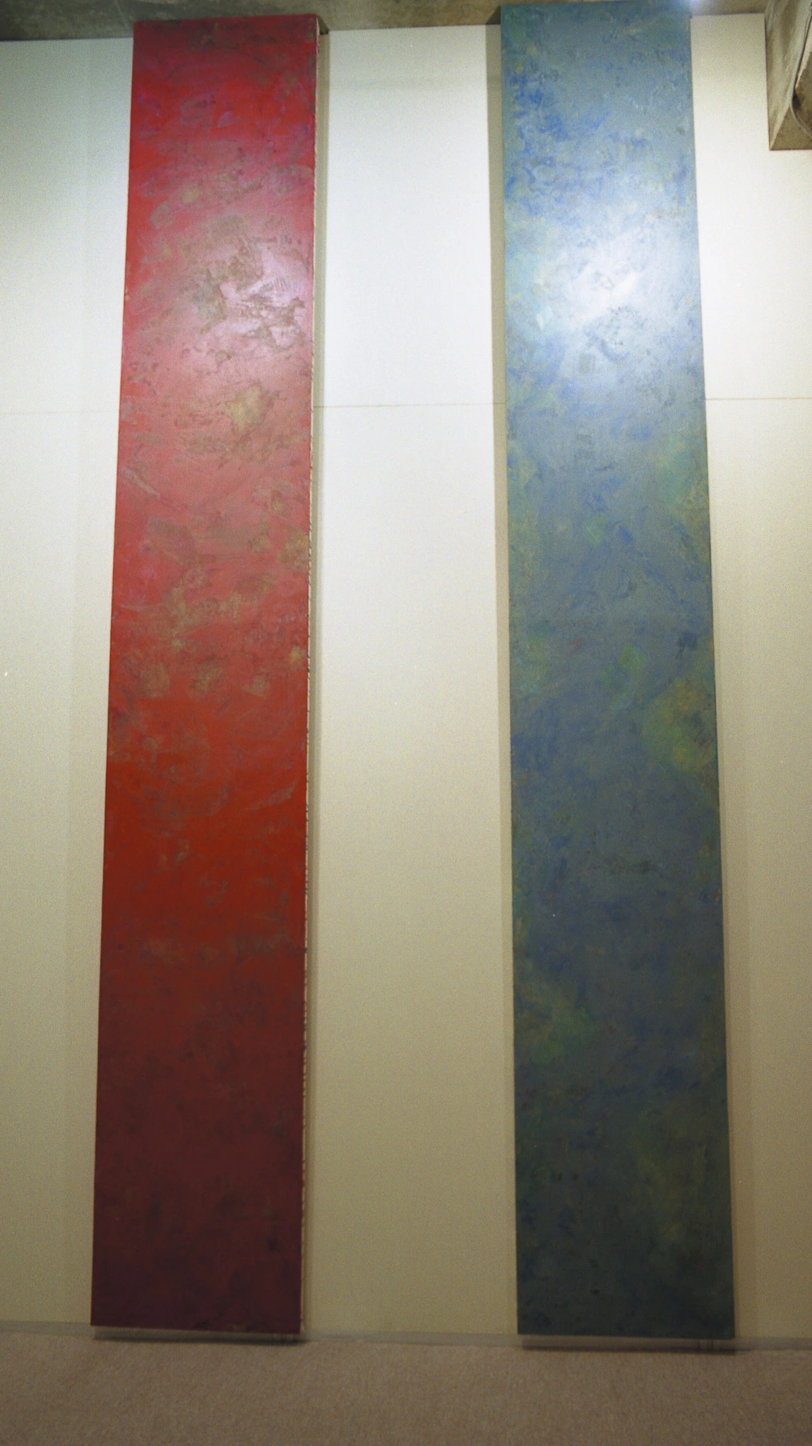 Two tall red and blue panels of Concentration toward Infinity (Fragment)
