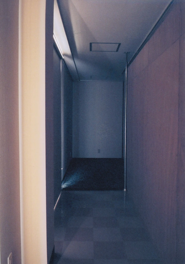 View farther along the corridor toward the darker space