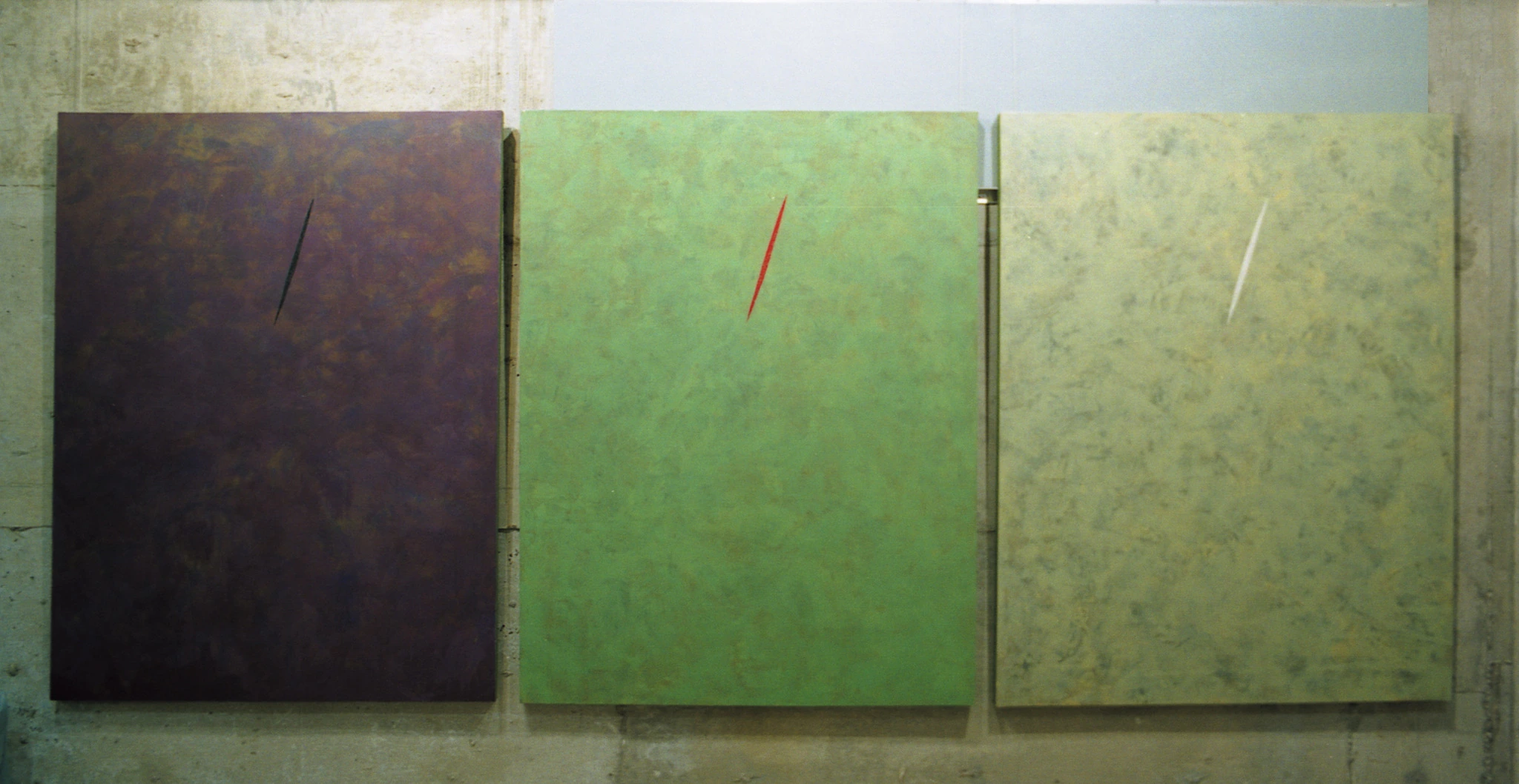 Front installation view showing the three paintings of Ghosts