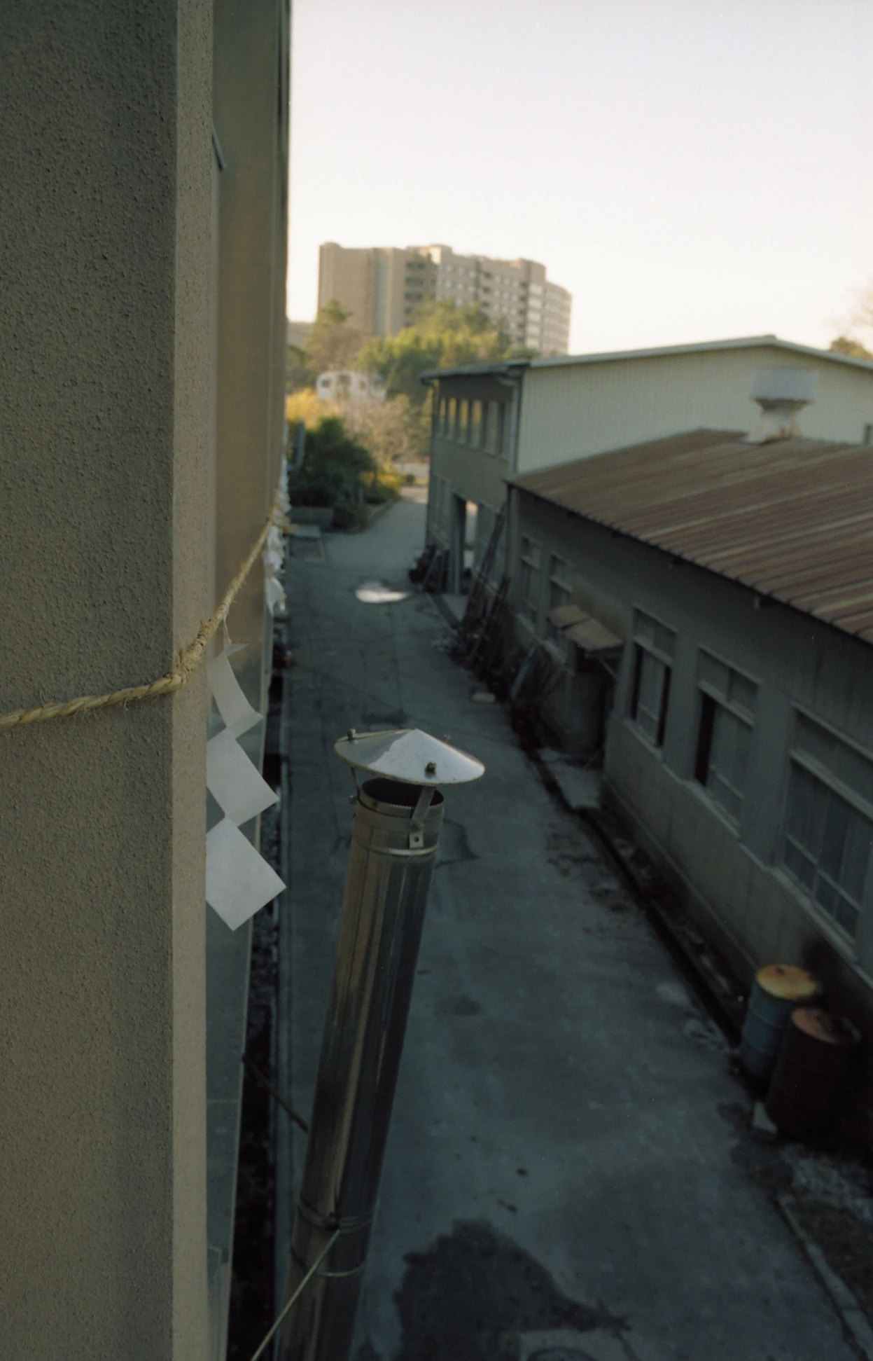 Rope and paper gohei running along a narrow exterior passage
