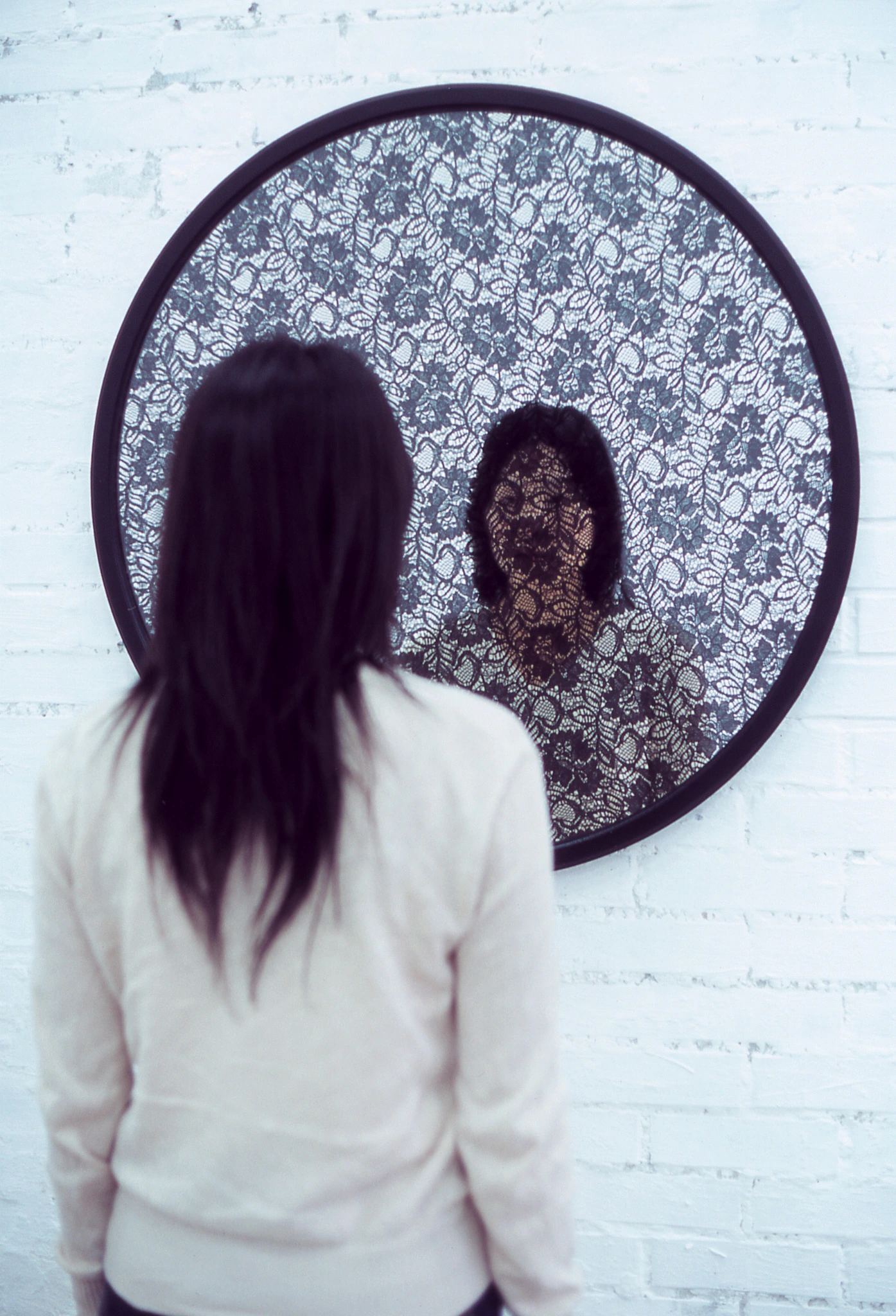 Viewer standing before Mirror Work — lace —, 2004