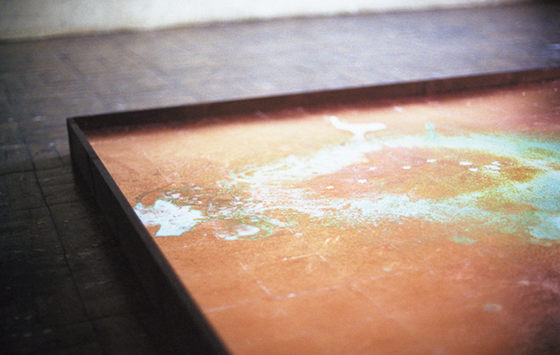 Corroded copper-foil surface with verdigris produced by repeated dripping